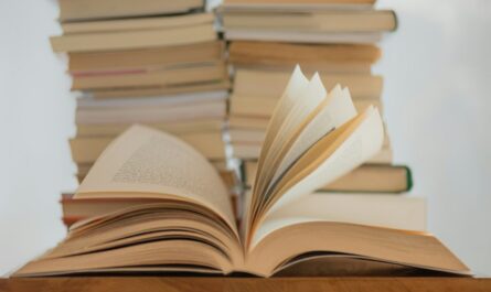 white book on brown wooden table